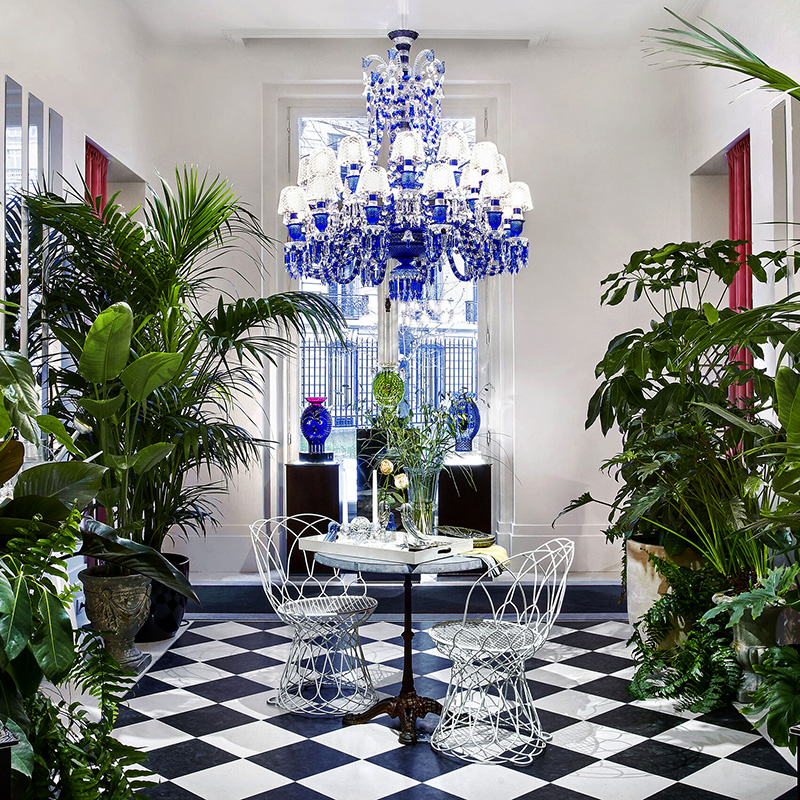 How do crystals enhance the beauty of chandeliers