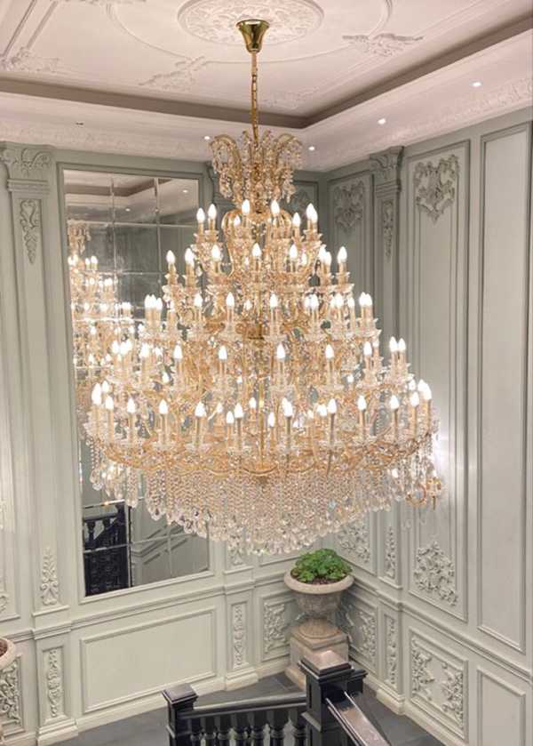 How do crystals enhance the beauty of chandeliers