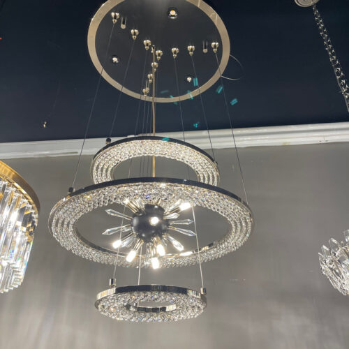 Illuminate with elegance using layered smoky crystal pendant light.