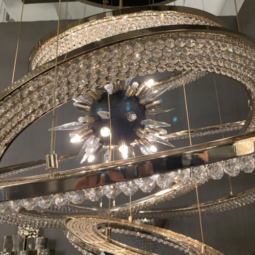 Illuminate with elegance using layered smoky crystal pendant light.