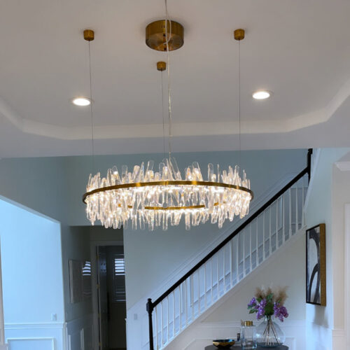 Enhance your space with a modern designer-decorated crystal chandelier.