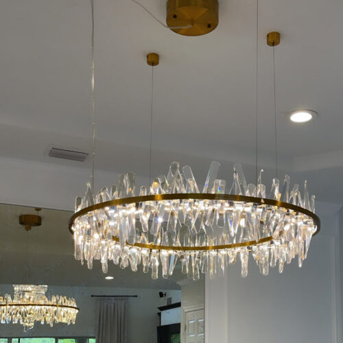 Enhance your space with a modern designer-decorated crystal chandelier.