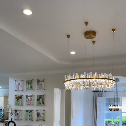 Enhance your space with a modern designer-decorated crystal chandelier.