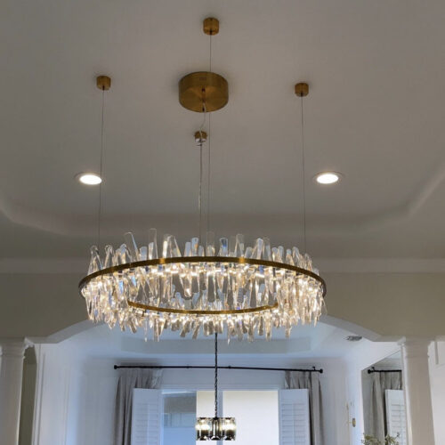 Enhance your space with a modern designer-decorated crystal chandelier.