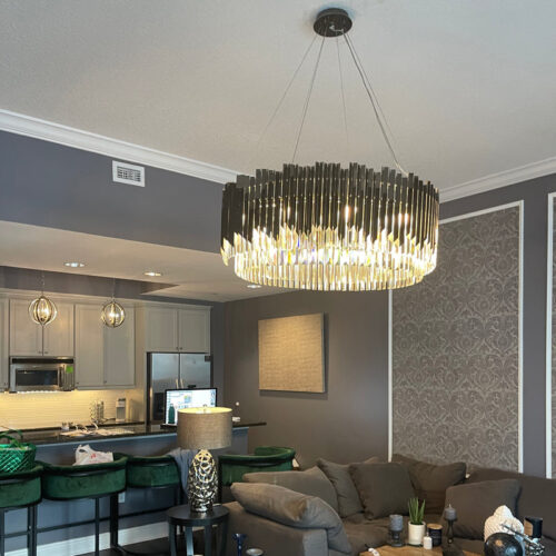 Elevate your hotel dining room with a decorative gold luxury chandelier and retro industrial pendant lamps.