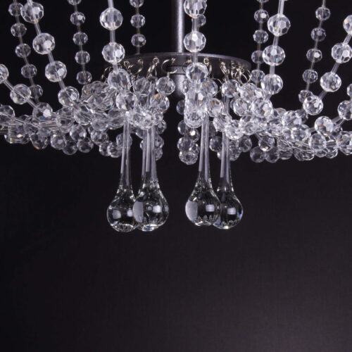 Illuminate your bar area with elegance using a crystal hanging bar light.