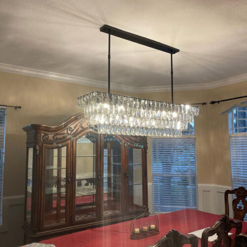 Enhance your kitchen with modern chandelier lighting for your counter area.