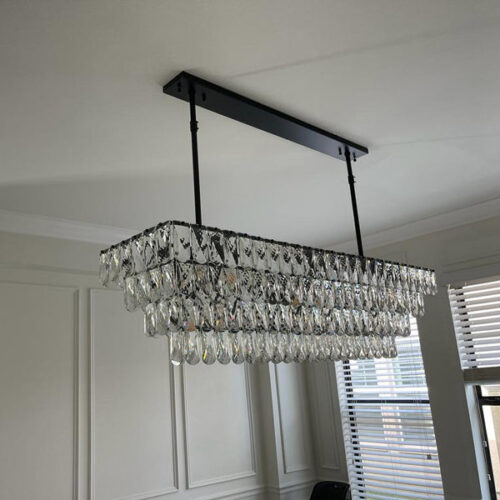 Enhance your kitchen with modern chandelier lighting for your counter area.